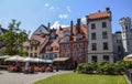 Cozy square with tables of decorated flowers street cafe in Riga, Latvia