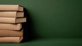 A cozy stack of brown hardbacks sits elegantly on a soft green backdrop, perfect for book lovers and aesthetic enthusiasts Royalty Free Stock Photo