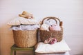 Cozy still life interior details. Organizing clothes in wicker baskets