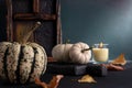 Cozy still life with small decorative pumpkins and aroma candle