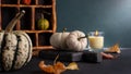 Cozy still life with small decorative pumpkins and aroma candle