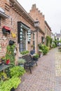 A cozy street full of flowers and plants in the old fortress town of Buren, the Netherlands