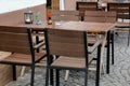 Cozy street restaurant. Tables and chairs in the street. Royalty Free Stock Photo