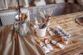Cozy studio of an artist, paints and brushes Royalty Free Stock Photo
