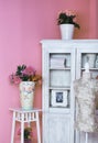 Cozy stylish vintage corner of the bedroom with flowers