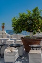Cozy table in a cafe with a white tablecloth with a beautiful view of the city of Positano in Italy Royalty Free Stock Photo
