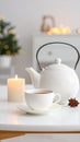 Cozy Tea Still Life with Candle and Christmas Tree Decoration in Soft Focus Royalty Free Stock Photo