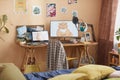 Cozy teenagers room with computer equipment