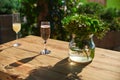 Cozy terrace, Glass with champagne on a wooden table. Royalty Free Stock Photo