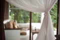 Cozy terrace with sofa behind white curtain tulle