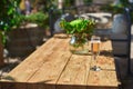 Cozy terrace with sofas for rest, Glass with champagne on a wooden table. Royalty Free Stock Photo