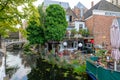 A cozy terrace on the water and a terrace boat in the canal in t