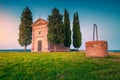 Cozy Vitaleta chapel with water well at sunset, Tuscany, Italy