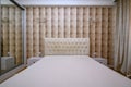 Luxury well designed modern beige bedroom, front view Royalty Free Stock Photo