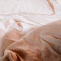 Cozy white bed with a pile of fluffy pillows and crisp white sheets Royalty Free Stock Photo