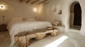 Cozy white bedroom with contemporary natural wooden tables in a warm interior setting Royalty Free Stock Photo