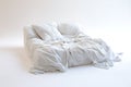 Cozy white comforter and pillows on a minimalist platform bed with soft lighting Royalty Free Stock Photo