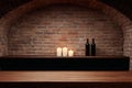 Cozy wine cellar with candles and bottles in a rustic brick setting during the evening Royalty Free Stock Photo