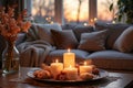 Cozy winter evening with candles and snacks in warm living room setting Royalty Free Stock Photo