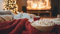 Cozy Winter Evening with Popcorn, Blanket, and a Cup of Tea Royalty Free Stock Photo