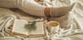 Cozy winter evening , warm woolen socks. Woman is lying feet up on white shaggy blanket and reading book. Cozy leisure scene Royalty Free Stock Photo