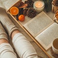 Cozy winter evening , warm woolen socks. Woman is lying feet up on white shaggy blanket and reading book. Cozy leisure scene Royalty Free Stock Photo