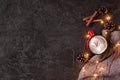 Cozy winter festive background with luminous garland and hot drink with marshmallow