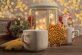 Cozy winter at home with hot drink and cookies. Christmas time with tea and garland Royalty Free Stock Photo