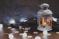 Cozy winter home. Lantern, candle, garland, snowflakes