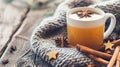 Cozy Winter Hot Tea with Cinnamon and Star Anise Wrapped in Knit Scarf Royalty Free Stock Photo