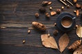 Cozy winter relax time. Cup of hot coffee with item brown on the old wood background in morning sunny day