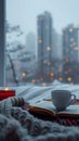 Cozy winter scene coffee, candle, book on bed with cityscape