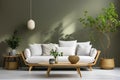Cozy wooden sofa with white cushions near dark green wall. Side table with houseplant and potted tree. Scandinavian interior Royalty Free Stock Photo