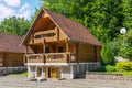 Cozy wooden three-storey villa with wide panoramic balconies and a tiled roof Royalty Free Stock Photo