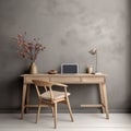 Cozy workplace with wooden writing desk and chair near grey wall. Interior design of modern Scandinavian home office