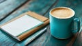 Cozy Workspace with Teal Coffee Mug, Note Pad, and Metal Pen for Study and Relaxation Royalty Free Stock Photo