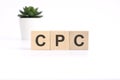 CPC - Cost Per Click - acronym on wooden cubes on white background. business concept