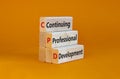 CPD, continuing professional development symbol. Wooden blocks with words CPD, continuing professional development on beautiful