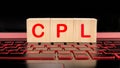 CPL - Cost Per Lead word written on wood block on the highlighted laptop keyboard