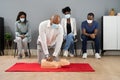 CPR First Aid Training With Paramedic Instructor Royalty Free Stock Photo