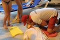 CPR training using and an AED and bag mask valve on an adult training manikin. First aid cardiopulmonary resuscitation course usin Royalty Free Stock Photo