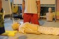 CPR training using and an AED and bag mask valve on an adult training manikin. First aid cardiopulmonary resuscitation course usin Royalty Free Stock Photo