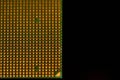 CPU pins. Central processor unit upside-down on a black background. Copy space on the right