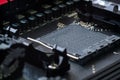 CPU socket and processor on the motherboard. Focus on the motherboard. Toned image Royalty Free Stock Photo