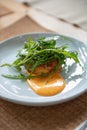 Crab Cake Dinner Recipe: Savor the Delight of Succulent Crab Cakes, Served with a Refreshing Rocket Salad Royalty Free Stock Photo