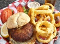 Crab Cake Sandwich with Onion Rings Royalty Free Stock Photo