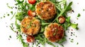 Crab cakes on arugula with cherry tomatoes and herbs