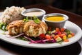 crab cakes served with dipping sauce and salad