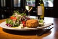 crab cakes served with a side of fresh salad