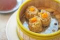 Crab Chinese steamed Dumpling with Salty Egg in bamboo steamer basket Royalty Free Stock Photo